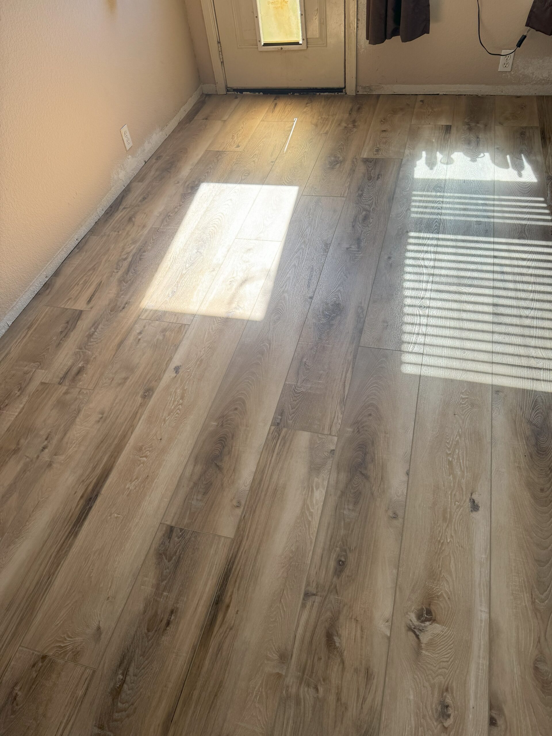 One month in - Vinyl flooring installed! Seaboard Oak by CALI Flooring.